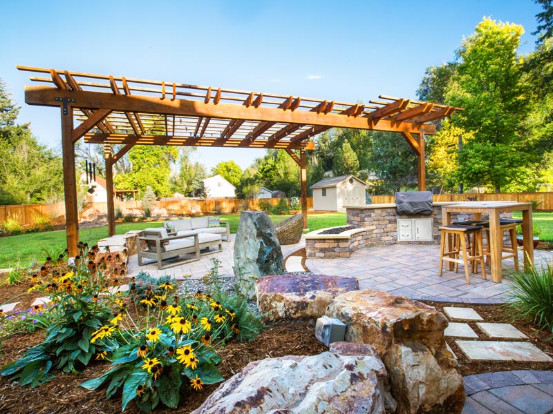 landscaping with outdoor kitchen and pergola